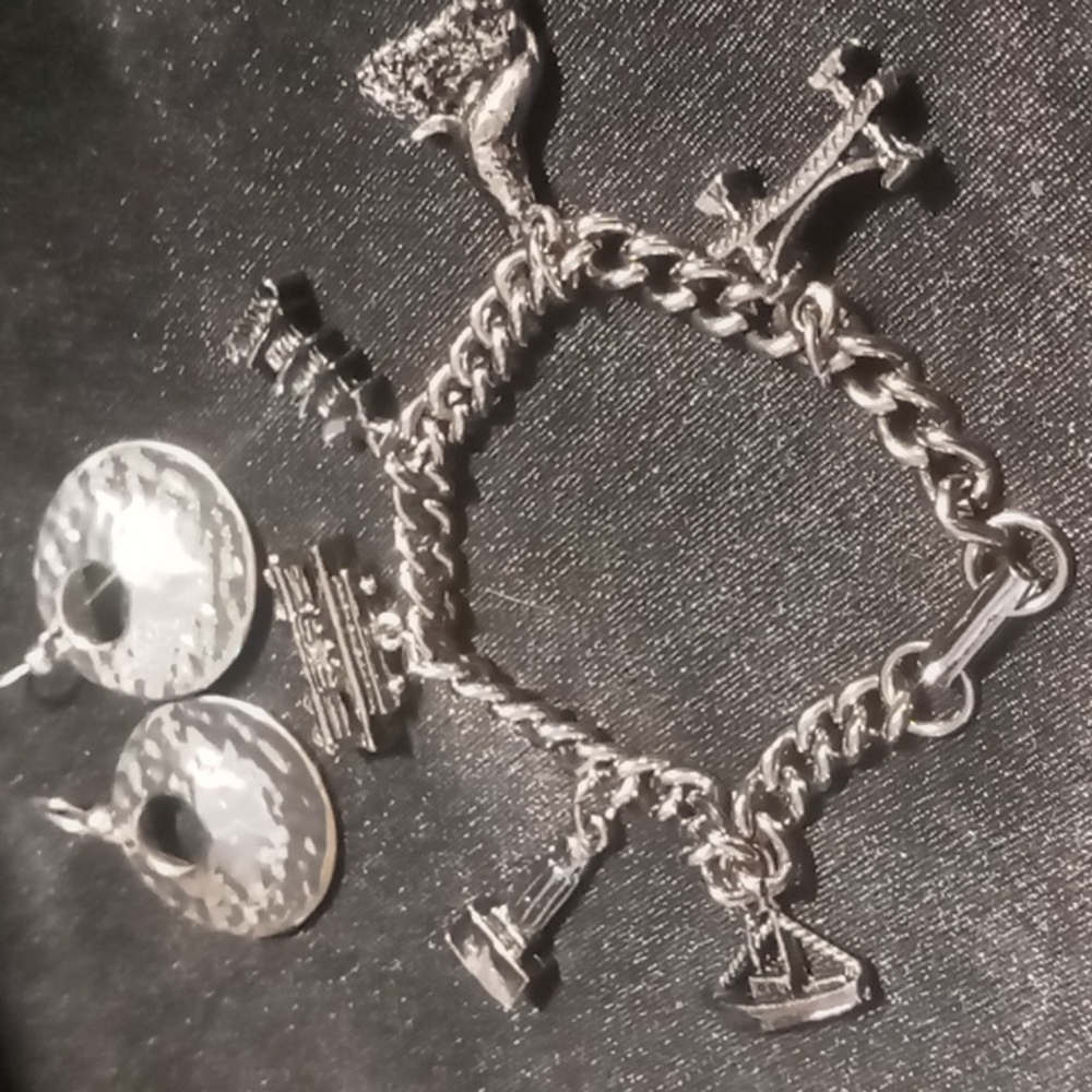Vintage Silver Charm Bracelet on a silky smooth polished curb chain 7.5 in.
